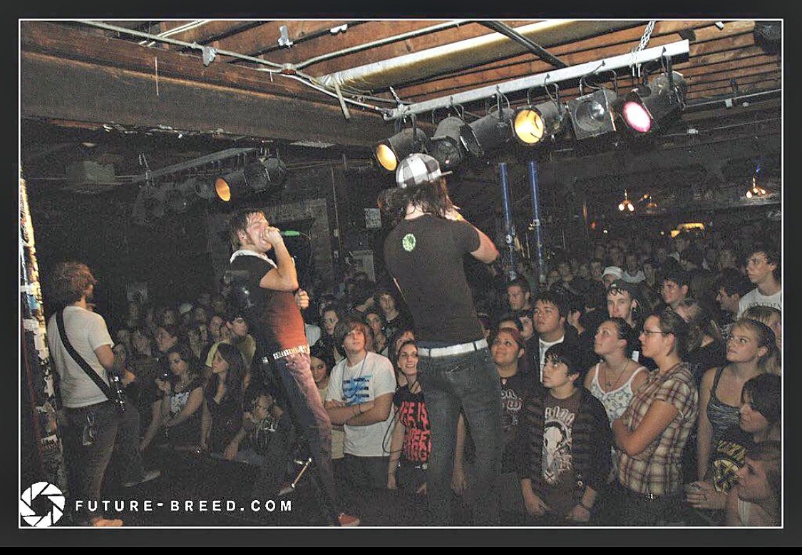Paul playing a show with his old band, on stage to the left