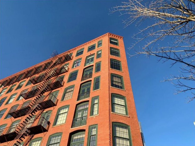 A historic red brick mill building in Providence, Rhode Island
